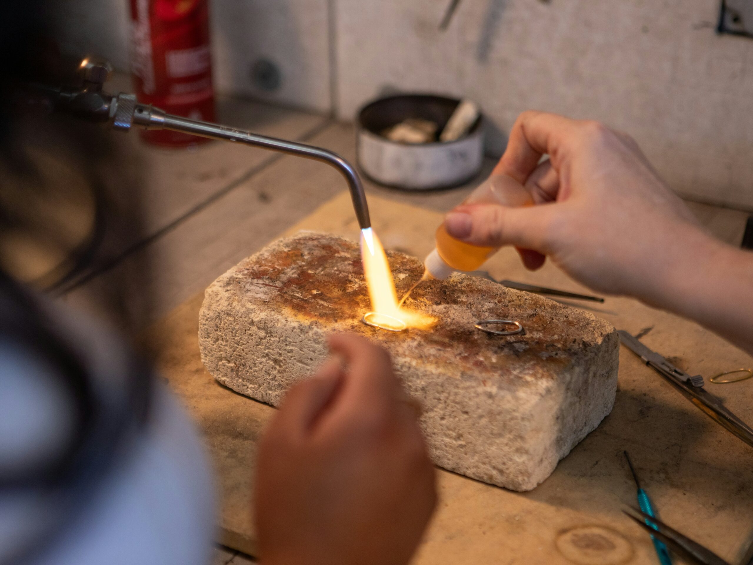 Professional silver sweat soldering on jewelry workbench