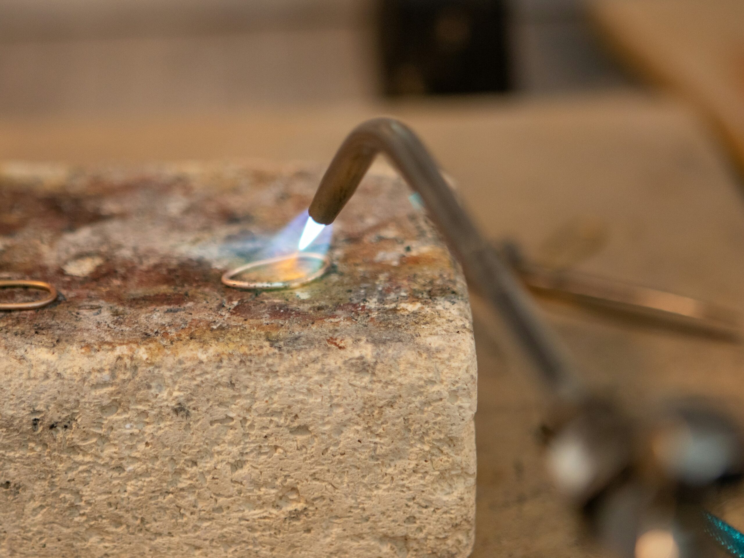 Sweat soldering silver jewelry with torch and solder setup