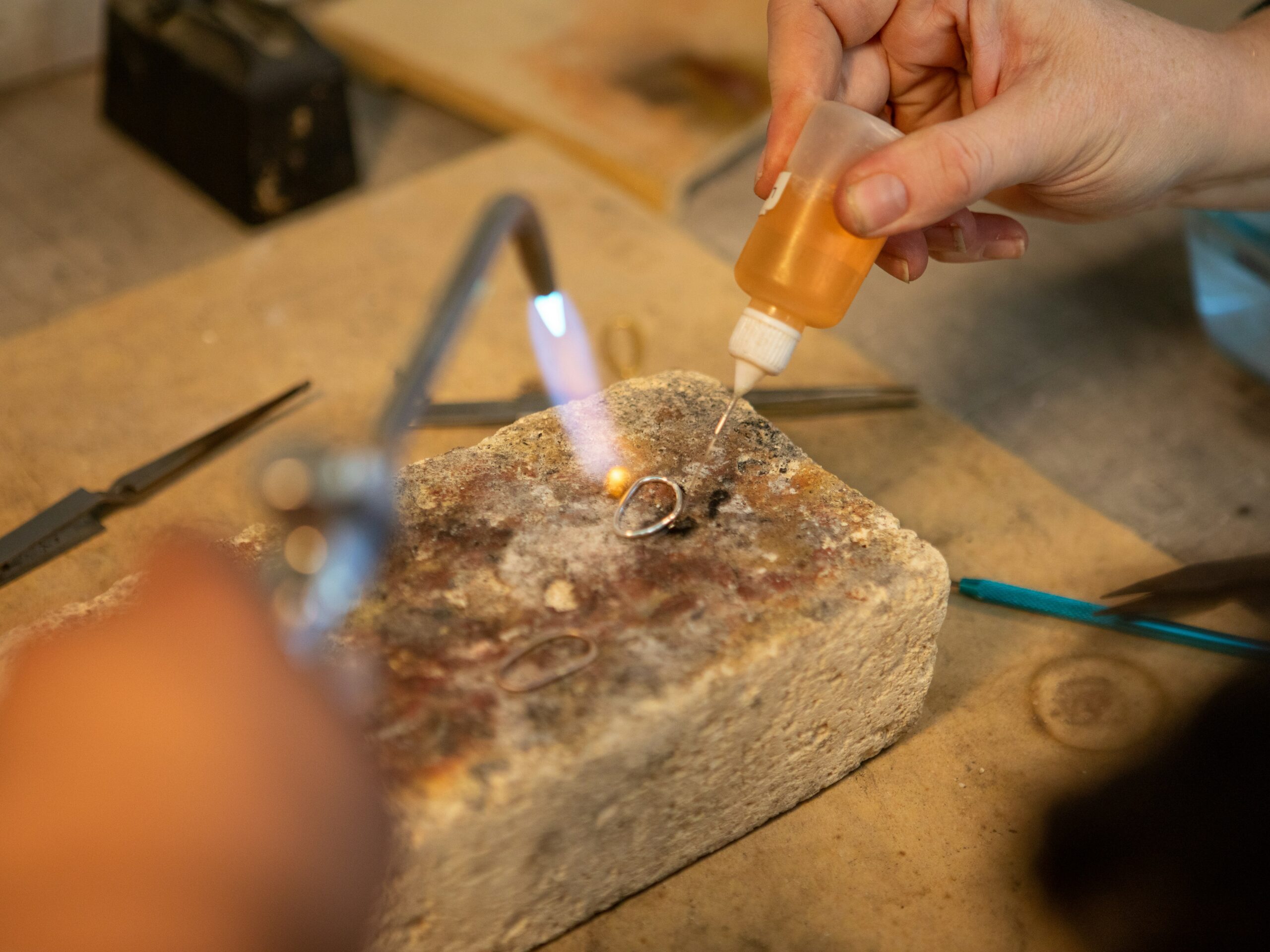 Silver jewelry torch flame and sweat soldering preparation