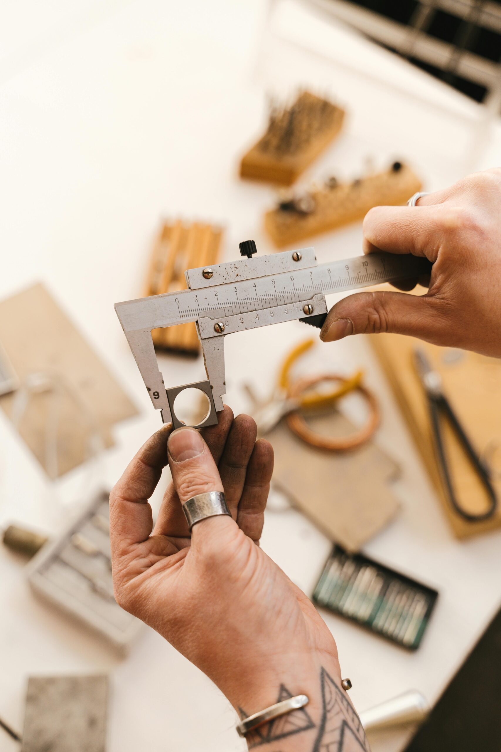 Silver jewelry inspection and detail checking on workbench