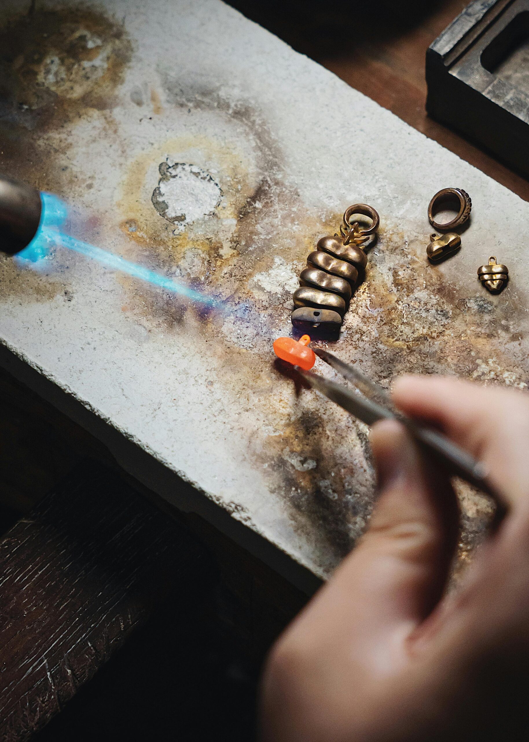 Silver soldering torch and flux preparation on jewelry bench