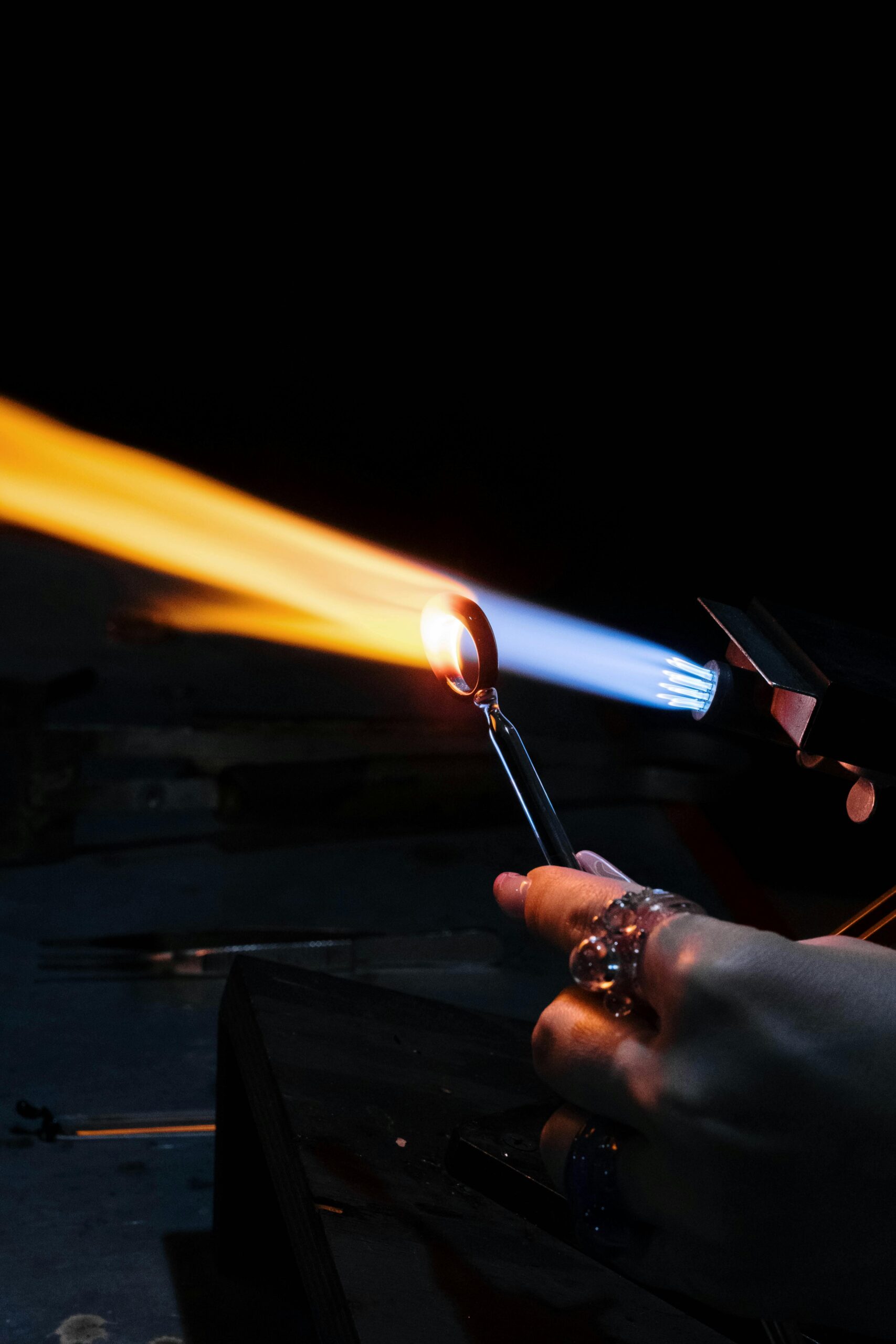 Jewelry torch flame during silver soldering on workbench