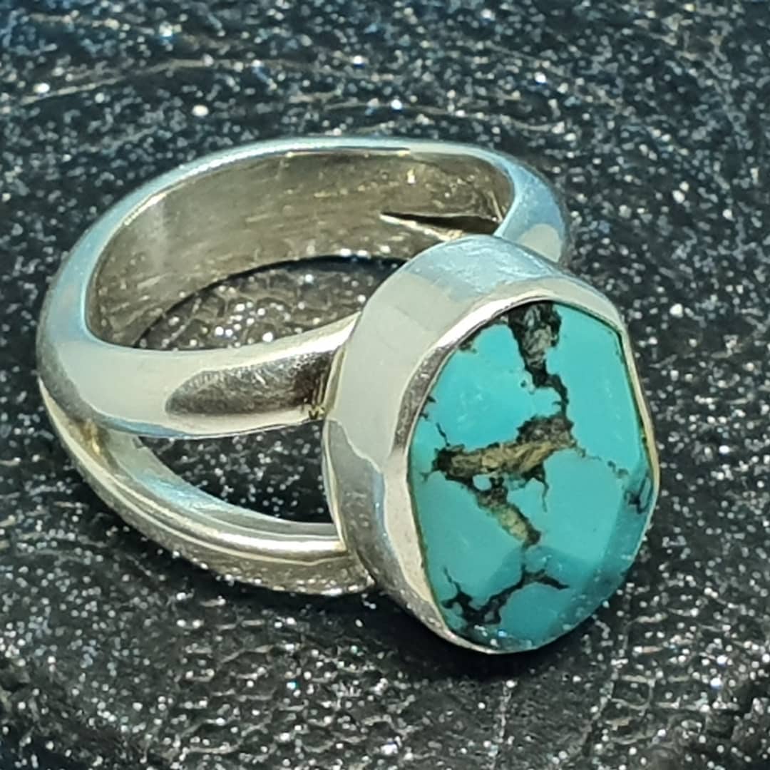 Handmade turquoise bezel ring in a jewelry workshop
