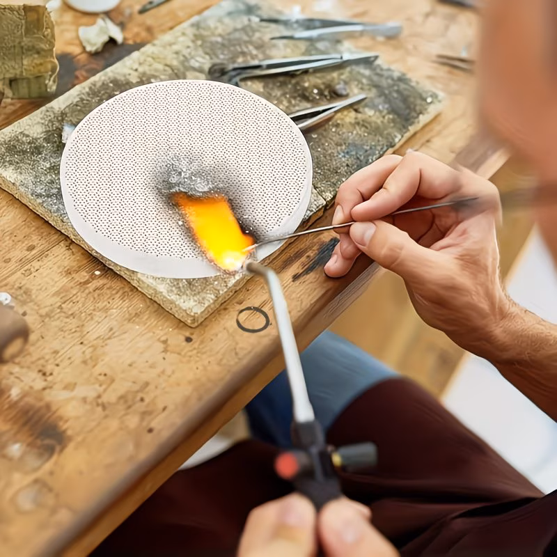 Jewelry soldering plate used for silver ring fabrication