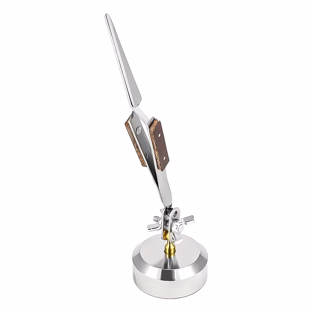 Closeup of jewelry soldering tweezers used for precise bench support