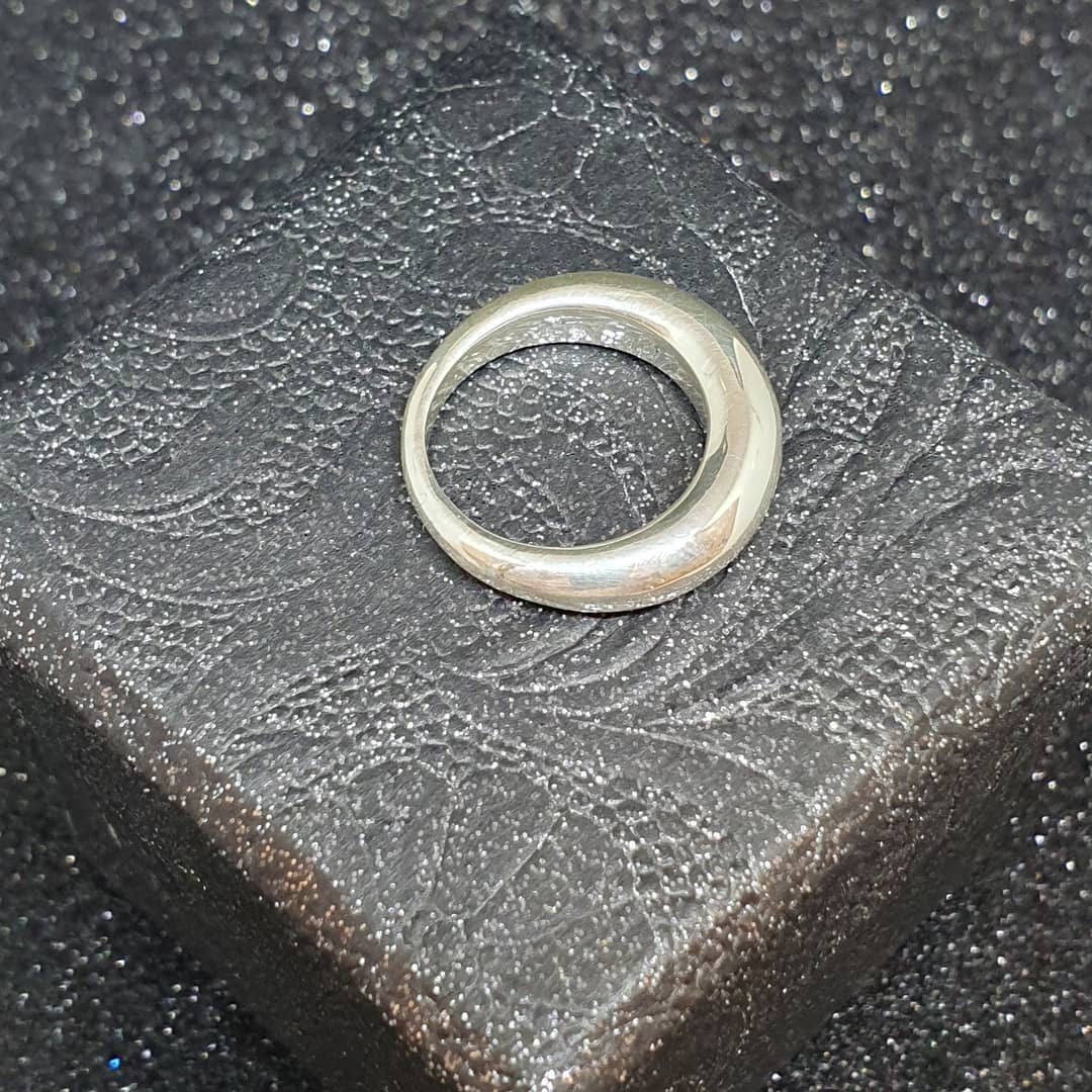 Textured finished silver ring showing how surface texture can reveal small defects
