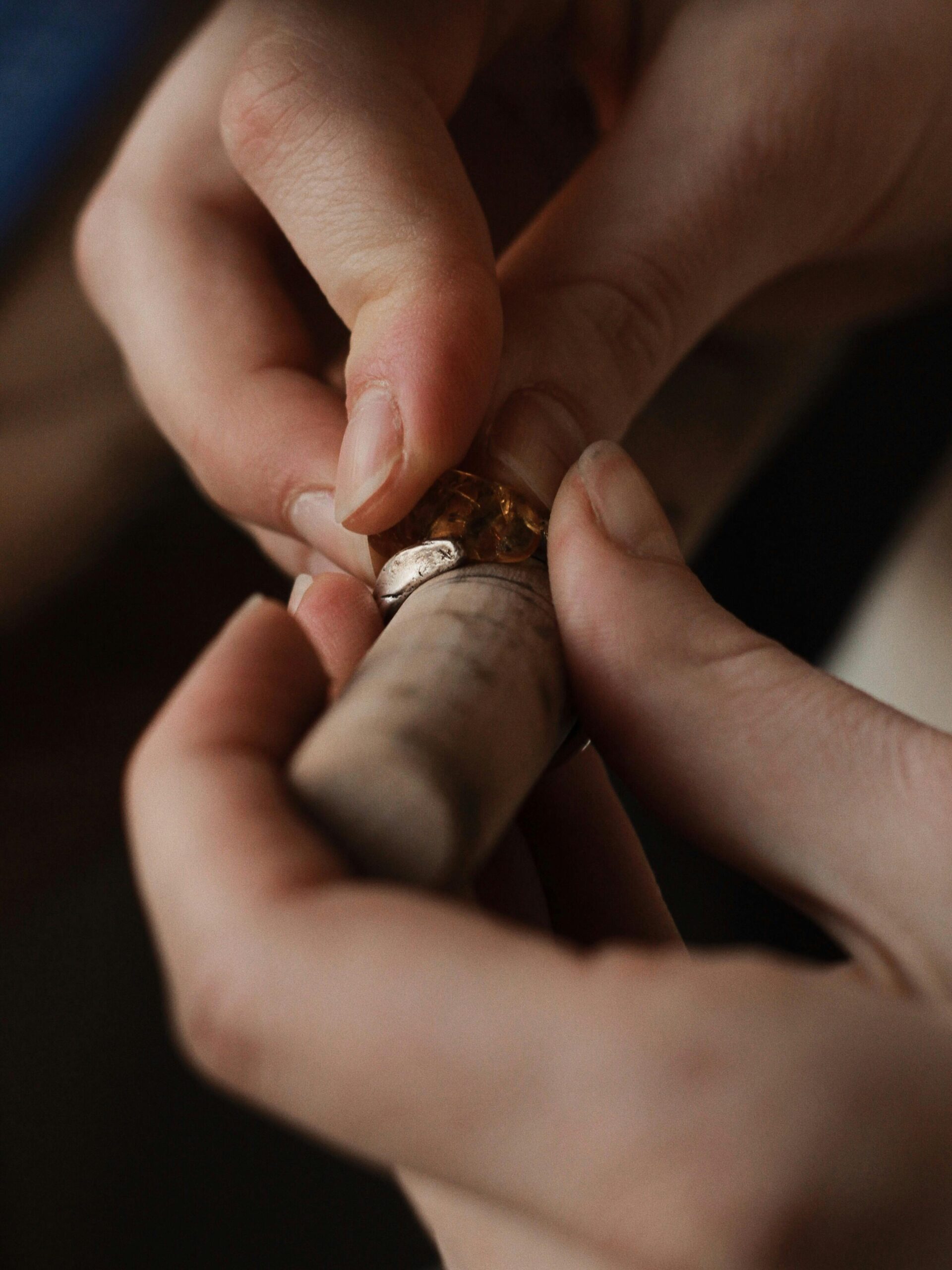 Jewelry maker checking a handmade ring component during ring blank planning