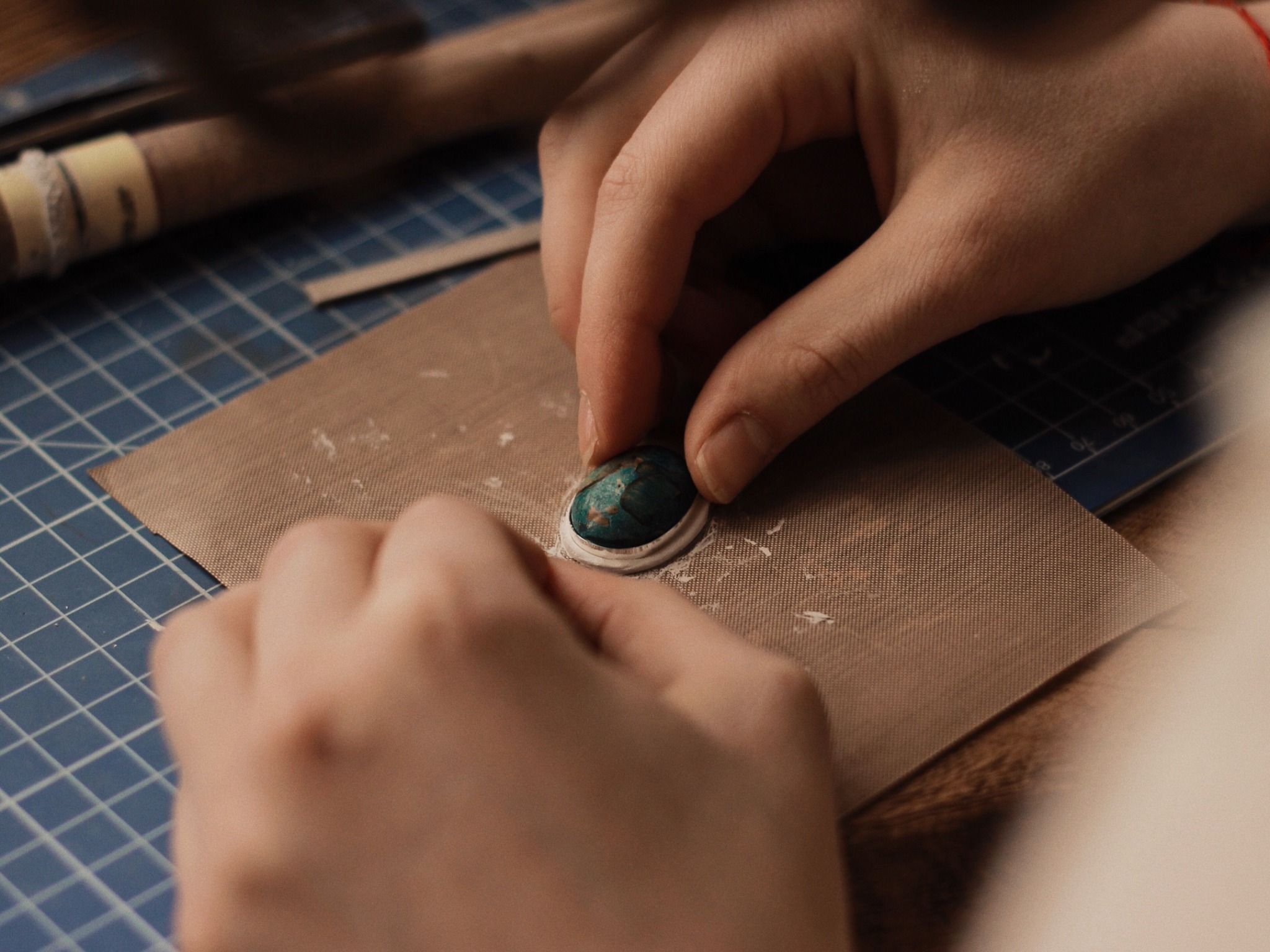 Cabochon stone being checked inside a bezel seat before final burnishing